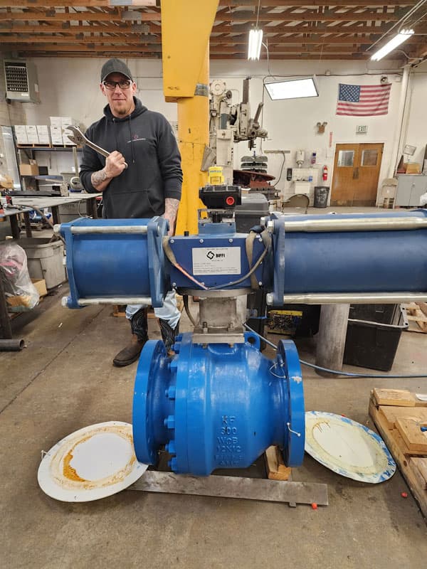 Machinist working on valve assembly